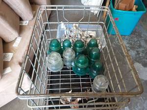 lot 18 image: Old Metal Milk Crate & Glass Insulators