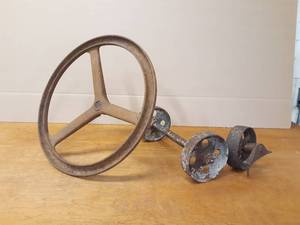 lot 13 image: Cast Iron Steering Wheel and Small Cast Iron Wheels