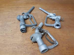 lot 153 image: (3) Antique Aluminum Gas Pump Handles