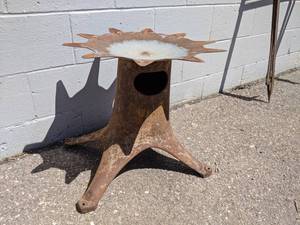 lot 110 image: Cast Iron Cream Separator Base made into Plant Stand  Yard Art