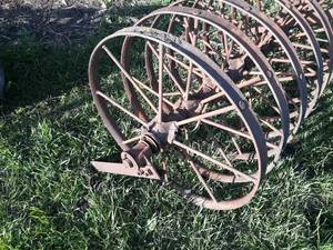 lot 24 image: Large Lot of (10) Steel Wheels from a Grain Drill - Each is about 26 Diameter x 1-12 Wide