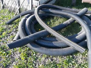 lot 34 image: Pile of Assorted Pieces of Drain Tile