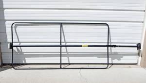 lot 1 image: Milwaukee 108 Inch Ratcheting Load Lock Cargo Bar With Welded Hoops