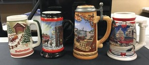 lot 131 image: Lot of 4 Budweiser Beer Steins ( 1992, 2001, 1991, and 1 unknown )