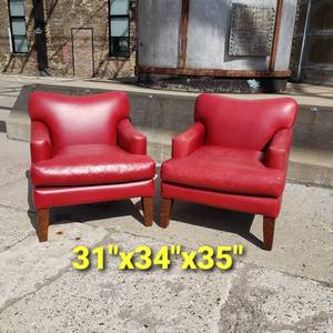 lot 49 image: Berry Red Accent Leather Arm Chairs and Ottoman