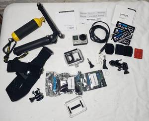 lot 110 image: GoPro Hero 4 and Accessories Bundle