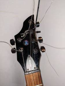lot 47 image: First Act ME636 Black 6 String Guitar