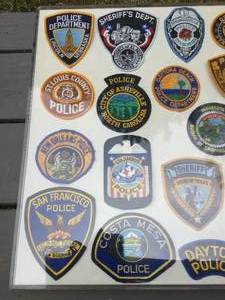 lot 369 image: Vintage Police Department Patches In a Plastic Frame