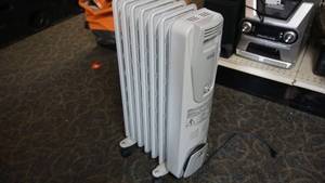 lot 23 image: DeLonghi Portable Radiator Heater