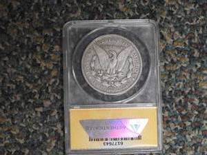 lot 22 image: 1891 CC Carson City Morgan Dollar ANACS graded F 12 details, scratched