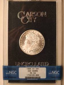 lot 16 image: 1884 CC Carson City Morgan Dollar UNCIRCULATED GSA Hoard NGC graded MS 64