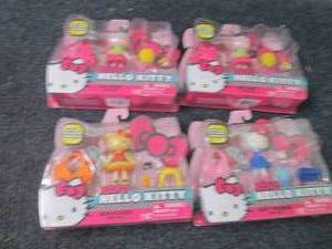 4 Hello Kitty Mini Dolls...