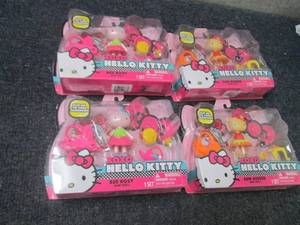 4 Hello Kitty Mini Dolls...