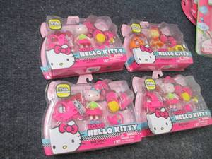 4 Hello Kitty Mini Dolls...