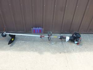 lot 10 image: Craftsman 2 cycle weed trimmer. Appears nearly new. Tested & works. As shown.