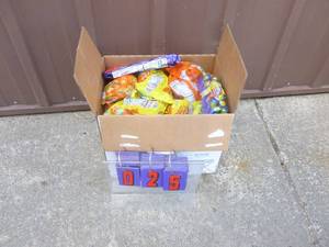 lot 25 image: Approx 25 lbs of assorted candy. Some may be out of date. As shown.