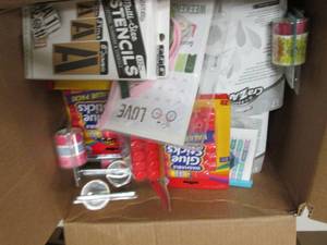 box of mostly packages of glue stic...