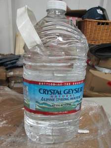 61 gallon jugs of crystal geyser n...