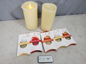 lot 124 image: 2 Scented Luminara Candles with Remote and Scent Pods