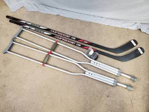 lot 153 image: New Hockey Sticks, Crutches