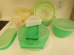 Collection OF Green Tupperware And Three Measuring Cups