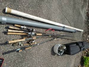 Large Collection of Fishing Poles and Reels