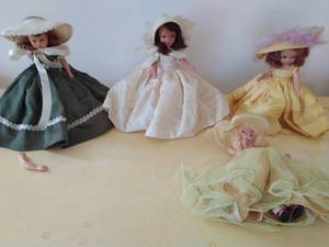 lot 135 image: Four Storybook Dolls
