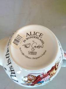 lot 97 image: Alice in Wonderland Tea Pot and Hot Pad