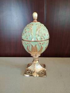 lot 228 image: Green with Lilly of the Valley Musical Egg by Wallace
