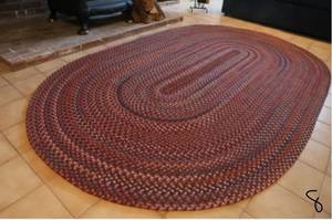 lot 8 image: Annie Red Velvet 5 ft. x 8 ft. Oval Indoor Braided Area Rug
