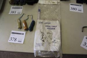 lot 378 image: Lot of (4) Equine Accessories  with Banders (x3), JorVet Oral Calf Feeder (x1 in original package)