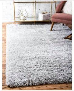 lot 14 image: Shag Silver Screen 9 0 x 12 0 Area Rug the retail price in Home Depot is $1238.00