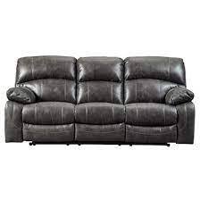 lot 25 image: Signature Design by Ashley, Dunwell Power Reclining Sofa with Adjustable Headrest Driftwood, 5160115 - BRAND NEW - NO RESERVE Features