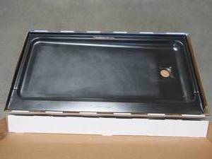 lot 106 image: Bootz Industries ShowerCast 60 in. x 30 in. Single Threshold Shower Pan in Matte Black with Square Chrome Shower Drain Cover Right Drain, 010-1002-99CH. - Some enamel Damage LH Front Corner.