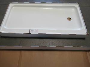 lot 107 image: Bootz Industries ShowerCast 60 in. x 30 in. Right Drain Single Threshold Shower Base in White, 010-1000-00 - Some enamel damage LH Front Corner.