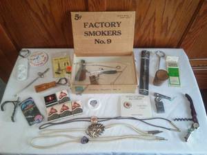Cigar box, 3 bolo ties, corkscrew, bottle openers.