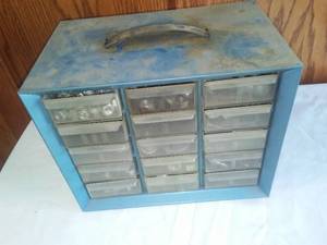 Metal parts drawer with contents.