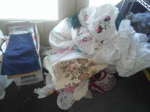 Large bag of aprons, tablecloths, sheets, pillowcases and more.