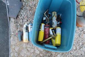 lot 850 image: Lot of Torch Accessories (in a plastic tote)  - Propane Tanks, Torch Wands, Misc. Supplies