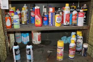 lot 879 image: Automotive Chemicals (on shelf)  with Battery Protector, Blaster Penetrating Grease, Sea Foam, Engine Degreaser, Iso Heet, Misc Chemicals