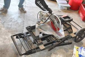 lot 880 image: Delta Sidekick Sliding Compound Miter Saw 10 36-240  with Rolling Workstation