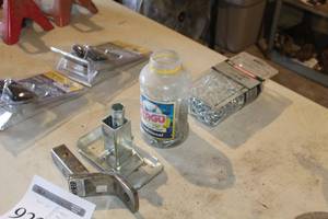 lot 922 image: Lot of (4) Hitch Accessories  - Chains (x2), Trailer Hitch (x1), Base (x1)