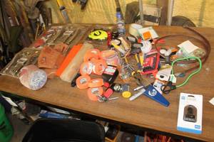 lot 973 image: Hand Tools  with USB Charger, Pliers, Flashlight, 2-cycle Oil, Grout Brush, Komelon 100, Rolls of Orange Tape, Jobsmart 3-piece Plier Set, Misc. Hand Tools