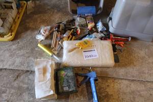 lot 1040 image: Painting Supplies (in tote)  with Canvas Drop Cloth, Tape, Caulk Gun, Brushes, Glue, and more