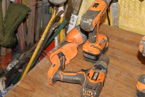 lot 1057 image: Lot of (3) Ridgid 18V Cordless Tools  - 12 Drill, 38 Drill, Flashlight and One Battery