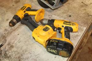 lot 1062 image: Lot of (3) DeWalt Cordless Tools  - 14.4V 38 Drill Driver DW991, 18V Light DW919, 18V 12 Hammerdrill DW997, and One Battery