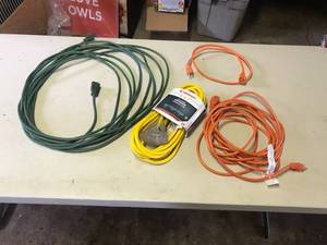 lot 1948 image: Lot of (4) Extension Cords  - Jobsmart 25 3-wire Receiver (new), Green (x1), Orange (x1), Orange Shorty (x1)