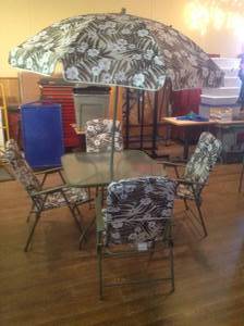 lot 9 image: Patio Table with Umbrella & 4 Chairs
