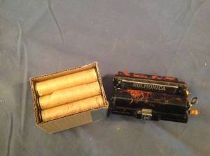 lot 214 image: Vintage Rolmonica & 9 Music Rolls