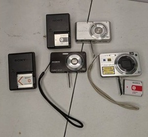 lot 610 image: (3) Sony Cybershot Point & Shoot Digital Cameras & (2) Battery Chargers